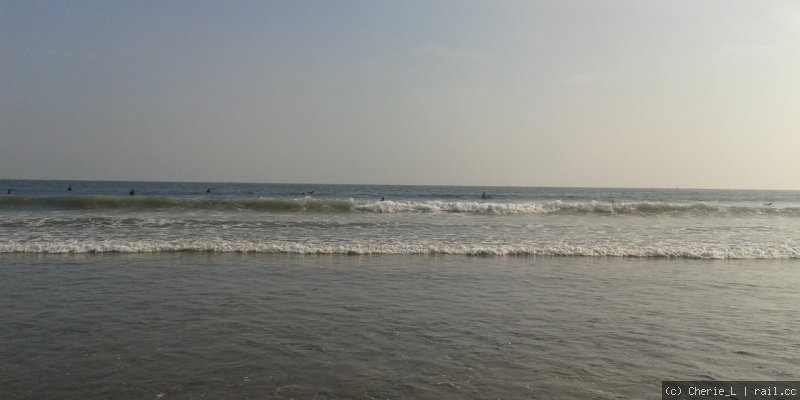 surfers in the waves at Kamakura beach